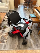 Paiseec lightweight folding electric wheelchair. Purchased 4 weeks ago Red.
