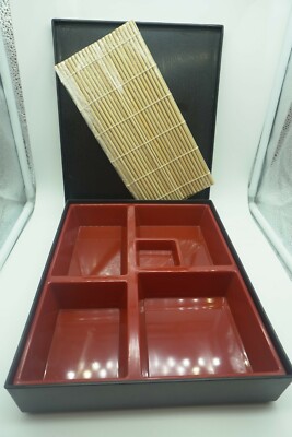 Japanese Bento Box with plastic wrapped Sushi Roller