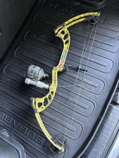 PSE Mudd Dawg Compound Bow Yellow Black with Reel Attachment