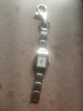generic, silver-toned quartz clip-on watch