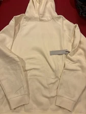 Fear of god essentials hoodie cream.
