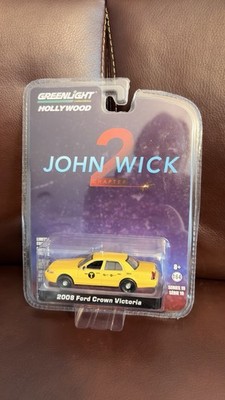 Greenlight Hollywood Series 19 John Wick 2 2008 Ford Crown Victoria Taxi NEW