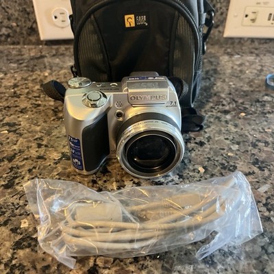 OLYMPUS SP510UZ DIGITAL COMPACT CAMERA IN ORIGINAL BOX And AN SD Card
