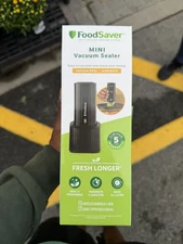 FoodSaver Mini Vacuum Sealer (cordless handheld model with base)