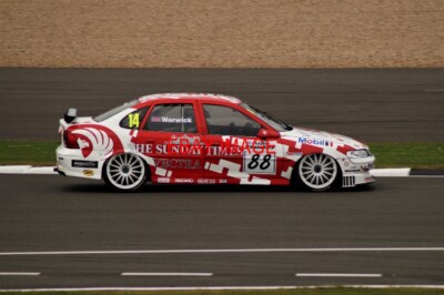 PHOTO  JAMES HANSON IN HIS EX-DEREK WARWICK VAUXHALL VECTRA SPEEDS THROUGH ABBEY