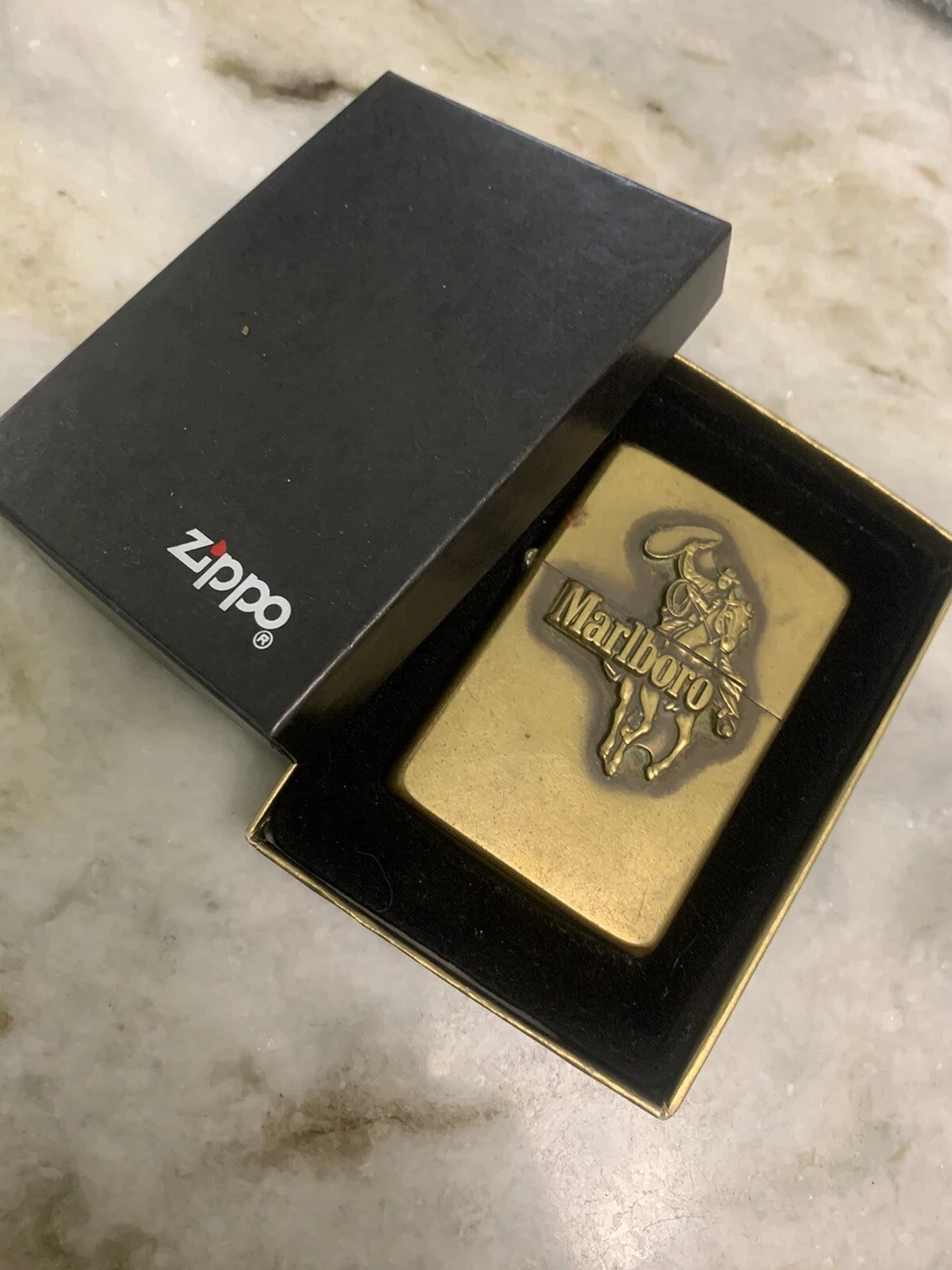 VINTAGE ZIPPO 1986 BRASS MARLBORO LIGHTER COWBOY ON HORSEBACK WITH LASSO