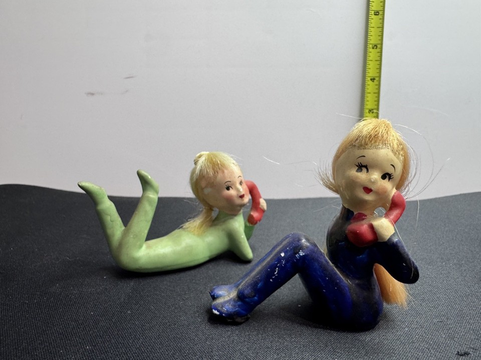 Hard-to-find pair of 1950s Japanese ceramic pixie girls on phones with ponytails — tiny, expressive, and utterly charming mid-century telephone art.