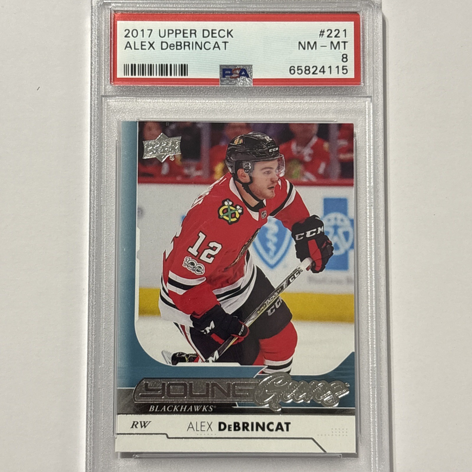 2017-18 Upper Deck Series 1 Young Guns Alex DeBrincat RC #221 PSA 8 Black Hawks