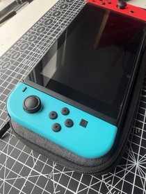 Nintendo Switch Handheld System + 256GB SD Disk & Super Mario Bros. U Deluxe