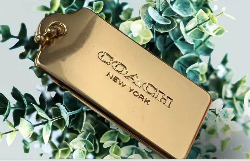 Coach gold metal shop hang tag