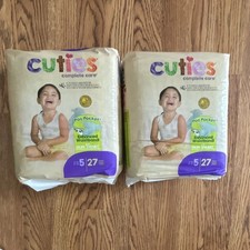 Two packs Cuties Complete Care Diapers Size 5, 27 lb Baby 27 Count perpackWhite