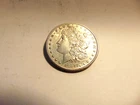 1884 S MORGAN DOLLAR ALMOST UNCIRULATED