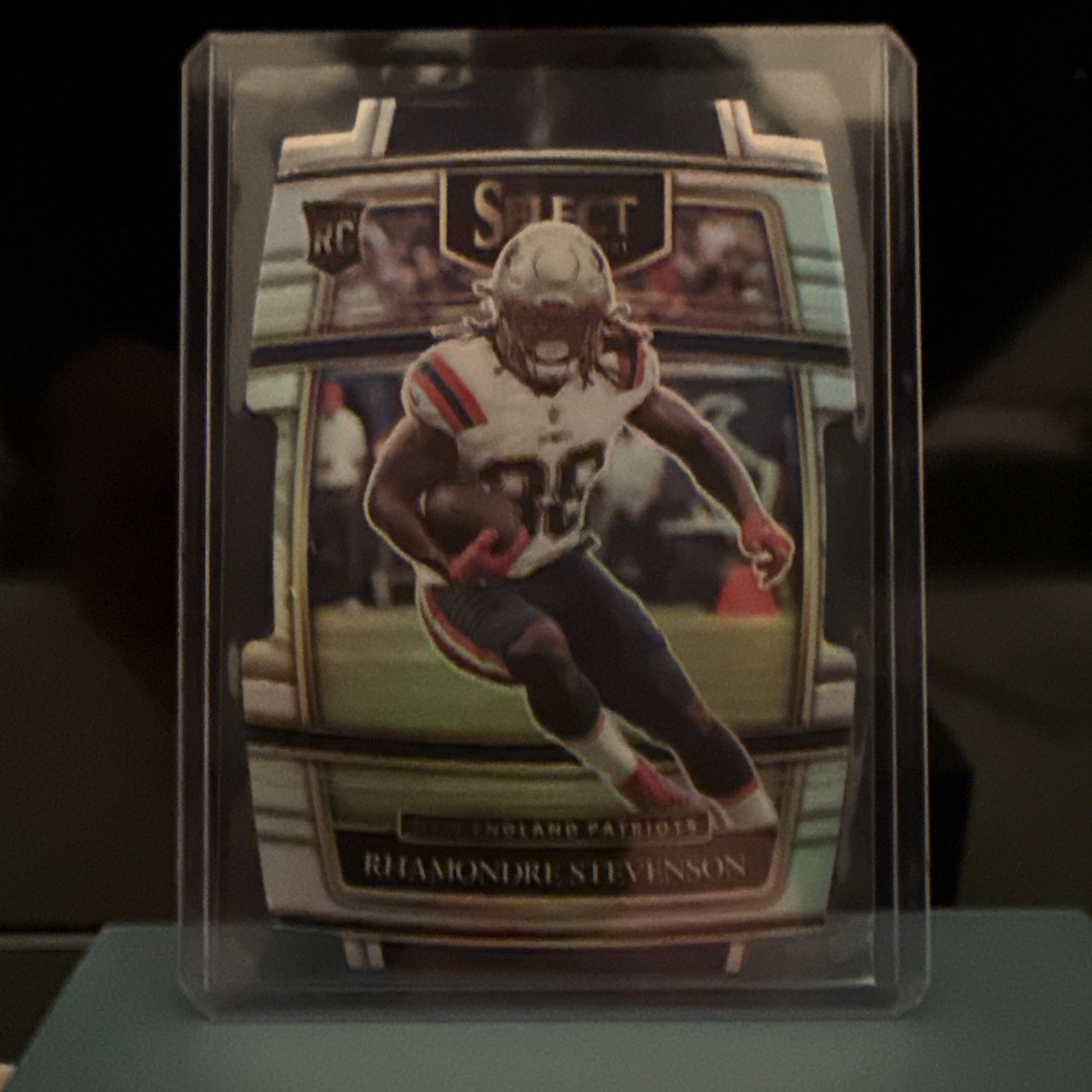 2021 Panini Select - Concourse Rhamondre Stevenson #75 Silver Prizm Die-Cut (RC)