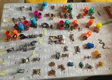 Large lot of Yowie animals by Kidcorp, 64 animals, 3 bonus, and 3 spare booklet