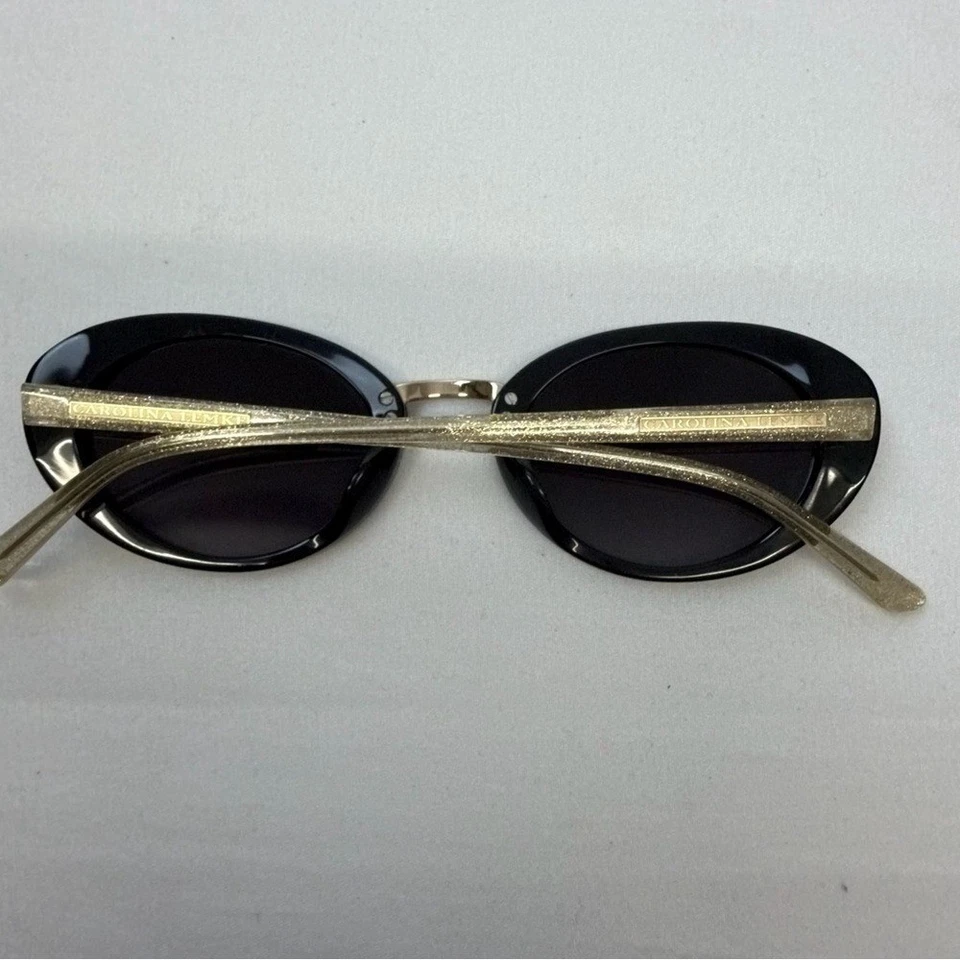 Gafas de sol para mujer Carolina Lemke marco negro ovalado dorado brillo brazos hechos a mano Foto 2 de 4