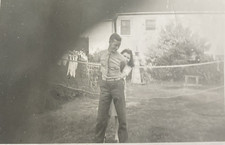1940s WWII Era Beautiful Pretty Girl Hiding Behind US Military Man Humor Photo