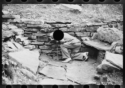 Photo:1930s Man Drinking Spring Water Stone Cave Grotto Rock Wall