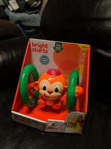 bright starts lights baby roll & glow monkey