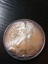 1997 Silver Eagle. Light purple peripheral toning. Pretty! No reserve.