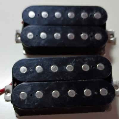 set black humbuckers from an Epiphone les Paul copy.