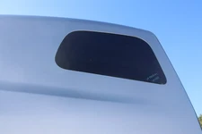 2018-2023 PETERBILT 579 PACCAR REAR LEFT UPPER CAB VENT GLASS WINDOW OEM