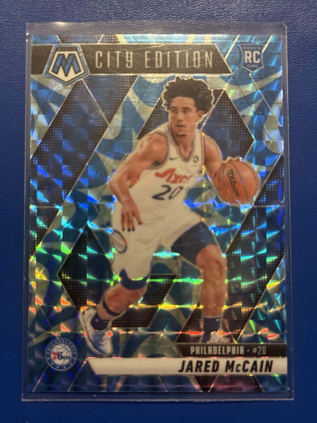 2024-25 Panini Mosaic City Edition Jared McCain #277 Reactive Blue Mosaic Prizm