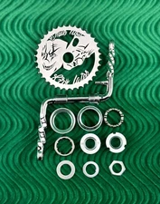 4 1/2" TWISTED 1 PIECE CHROME BIKE CRANK W/ SMILE NOW/CRY LATER SPROCKET & B.B