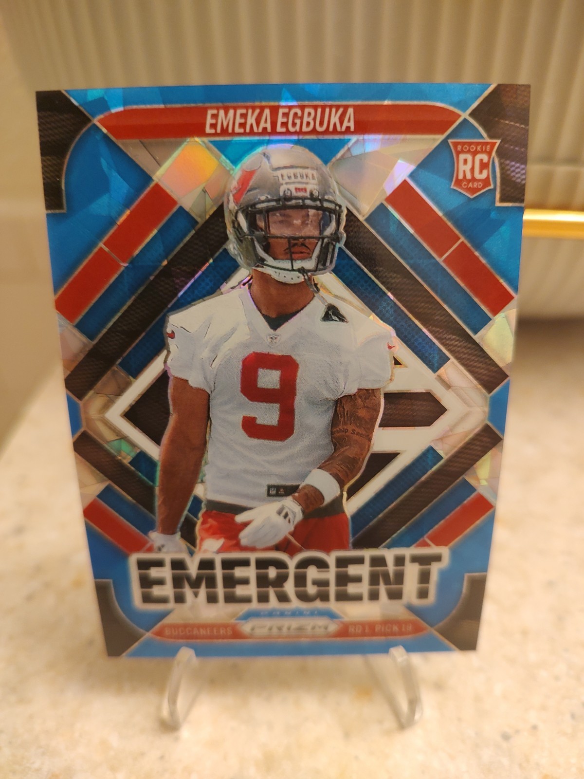2025 Panini Prizm - Emergent Emeka Egbuka #3 Blue Ice Prizm /99 (RC)