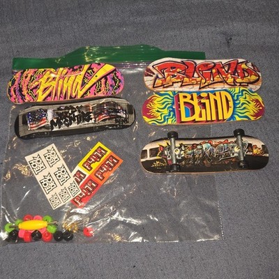 lot of 5 tech decks with customisation before with stickers, wheels, add ons etc