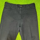 Dark navy blue vintage Wrangler Wrancher 40 x 34 bootcut jeans with brown rivets and button, USA made 90.