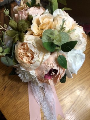 Beautiful Bridal Bouquet featuring peach, pink and white peonies and roses