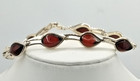 Bracelet ancien en argent massif et ambre rouge pressé