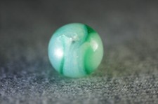 Akro Agate Transparent Green Spiral on Translucent Base 187