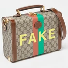 Sac étui beauté Gucci marron/beige GG Supreme toile et cuir faux/pas savoyard