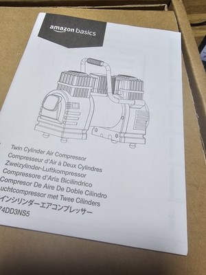 Amazon Basics - Tragbarer digitaler Luftkompressor, zwei Akkuklemmen