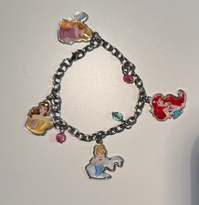 Metal charm bracelet featuring Disney Princesses characters