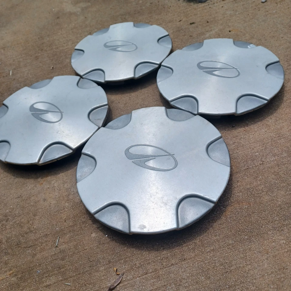 Oldsmobile Bravada Juego de 4 tapas centrales, 1998-2001 parte # 15715636 Foto 2 de 3