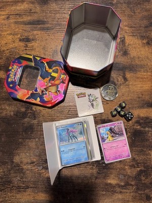 Mini Portfolio filled with random Cards packaged in a randon tin