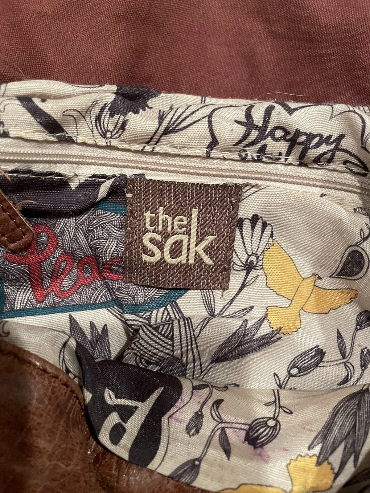 Borsa zaino a tracolla convertibile The Sak Ventura in pelle invecchiata marrone teak