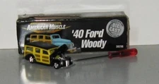 Ertl American Muscle, black/yellow Ford Woody, 1/64 assembled  from kit.