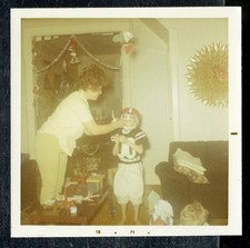 Vintage Christmas Photo YOUNG BOY DRESSED IN FOOTBALL JERSEY AND HELMET 1970 02