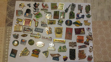60 pin's divers dont Disney ,sport, parfait état tous avec attache & sans double