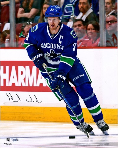 Henrik Sedin Vancouver Canucks Signed 16" x 20" Blue Jersey Skating Photo