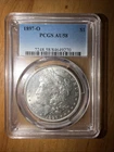 1897-O PCGS AU58 Morgan Silver Dollar