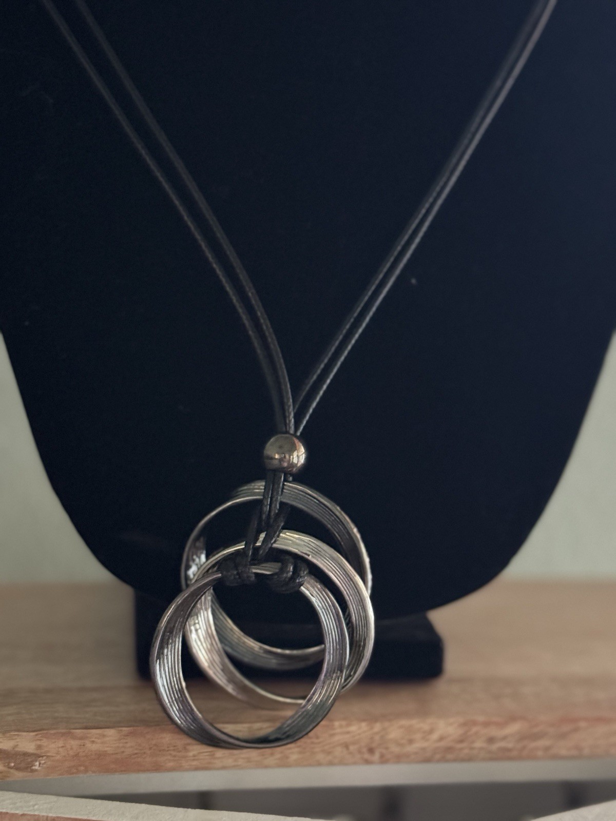 Silver Circle Pendant Necklace with Black Cord for Modern Style