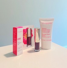 Clarins Beauty Flash Balm has 15 mL and Comfort Lip Oil Travel Size in Chocolate