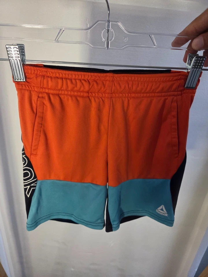 Pantalones Cortos Atléticos Reebok Niño Cómodos Naranja y Azul Teal 100% Poliéster Talla 4T Foto 2 de 4