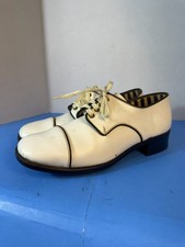 Vintage Oxford-style shoes combine elements of 1950s and 1970s fashion.