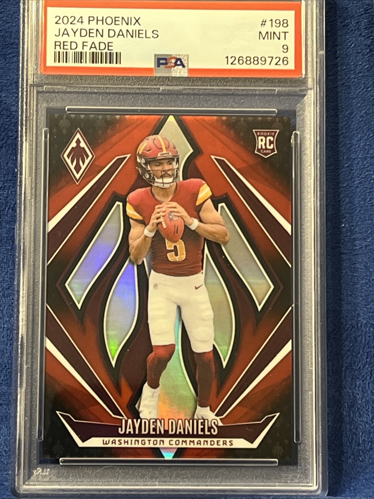2024 Panini Phoenix - Rookies Jayden Daniels #198 Red Fade 067/299 (RC) PSA 9