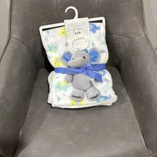 The set includes soft blanket with an elephant pattern and a plush elephant toy